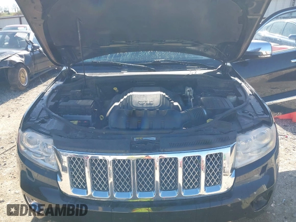 2013 Jeep Grand Cherokee Overland with VIN 1C4RJFCT1DC654653, listed as a IAAI auction lot 41826619 with 124,283 mi miles. Bid and sale history available at carsss.com. Image 10.