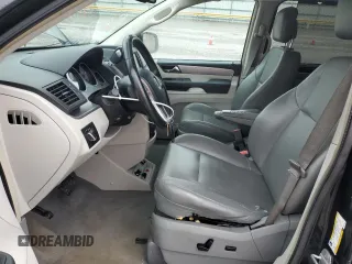 2013 Volkswagen Routan SE z VIN 2C4RVABGXDR724928, wystawiony jako Copart lot #54795185 z przebiegiem 147 652 mil mil oraz Szkoda całkowita • Salvage title. Historia ofert i sprzedaży dostępna na DreamBid. Obrazek 7.