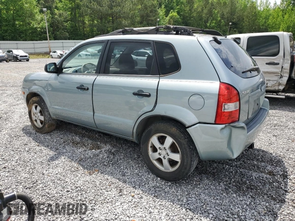 2005 Hyundai Tucson GL with VIN KM8JM12B05U148660, listed as a Copart auction lot 54302805 with 257,233 mi miles and Salvage title. Bid and sale history available at DreamBid. Image 2.