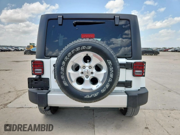 2014 Jeep Wrangler Unlimited Sahara with VIN 1C4BJWEG5EL309502, listed as a Copart auction lot 61804885 with 60,683 mi miles and Salvage title. Bid and sale history available at DreamBid. Image 6.