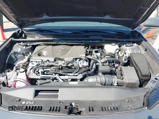 2025 Toyota Camry LE z VIN 4T1DAACK4SU572097, wystawiony jako IAAI lot #41827762 z przebiegiem 8 106 mil mil oraz . Historia ofert i sprzedaży dostępna na DreamBid. Obrazek 10.