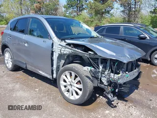 2013 Mazda CX-5 Grand Touring with VIN JM3KE4DE9D0137085, listed as a IAAI auction lot 41978534 with 103,720 mi miles and . Bid and sale history available at carsss.com. Image 1.