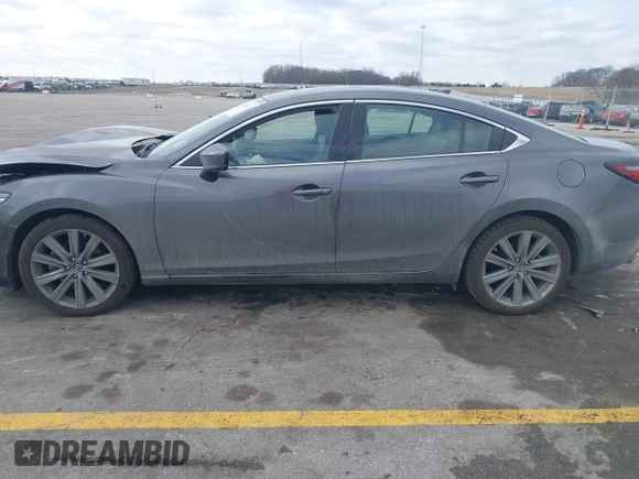 2020 Mazda 6 Grand Touring with VIN JM1GL1TY6L1525169, listed as a IAAI auction lot 41683512 with 73,313 mi miles and . Bid and sale history available at DreamBid. Image 14.