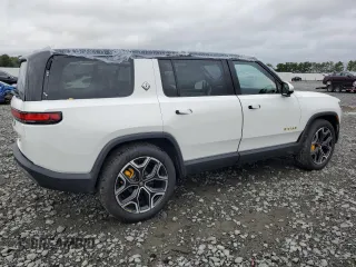 2023 Rivian R1S Adventure z VIN 7PDSGABA6PN017889, wystawiony jako Copart lot #68860864 z przebiegiem 7661 mil mil oraz Szkody całkowita. Historia ofert i sprzedaży dostępna na DreamBid. Obrazek 3.