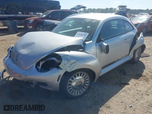 2014 Volkswagen Beetle 2.5L w/Sun with VIN 3VWJP7AT7EM633386, listed as a IAAI auction lot 42060290 with 273,374 mi miles and . Bid and sale history available at DreamBid. Image 2.