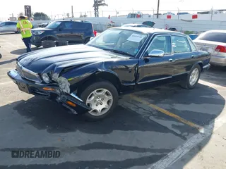 2003 Jaguar XJ 8 with VIN SAJDA14C03LF58706, listed as a IAAI auction lot 41619740 with 95,293 mi miles and . Bid and sale history available at DreamBid. Image 17.