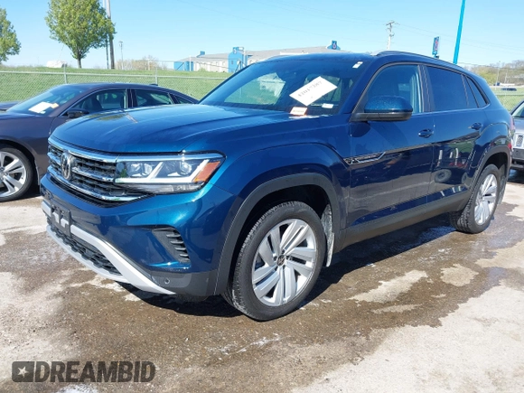 2021 Volkswagen Atlas SE z VIN 1V2KE2CA7MC220524, wystawiony jako IAAI lot #42017287 z przebiegiem 29 380 mil mil oraz . Historia ofert i sprzedaży dostępna na DreamBid. Obrazek 18.