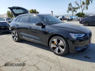 2022 Audi e-tron Premium Plus with VIN WA1LAAGE3NB009881, listed as a Copart auction lot 55096875 with 31,718 mi miles and Salvage title. Bid and sale history available at DreamBid. Image 4.