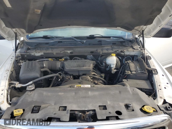 2013 Ram 1500 SLT z VIN 3C6JR7EP9DG528945, wystawiony jako Copart lot #57065605 z przebiegiem 148 498 mil mil oraz Czysty tytuł • Clean title. Historia ofert i sprzedaży dostępna na DreamBid. Obrazek 11.