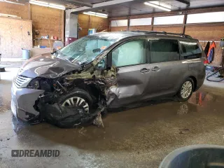 2012 Toyota Sienna XLE AAS with VIN 5TDYK3DC6CS263811, listed as a Copart auction lot 52485765 with 0 mi miles and Salvage Title. Bid and sale history available at carsss.com. Image 1.