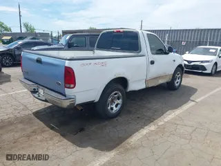 1999 Ford F-150 Work Series with VIN 2FTZF1729XCA83871, listed as a IAAI auction lot 42009506 with 234,988 mi miles. Bid and sale history available at carsss.com. Image 4.