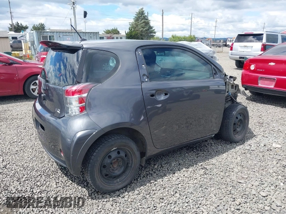 2012 Scion iQ with VIN JTNJJXB00CJ018659, listed as a IAAI auction lot 42232715 with 142,516 mi miles and . Bid and sale history available at DreamBid. Image 4.