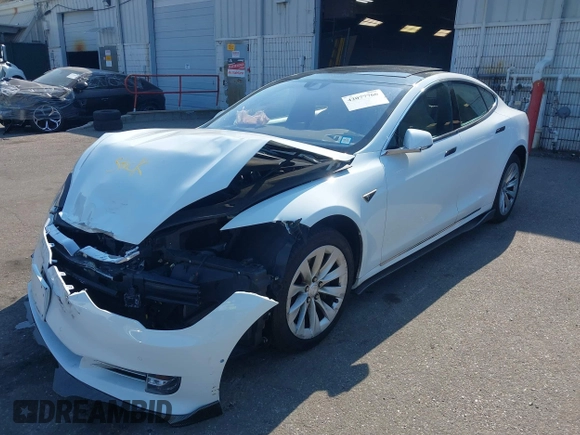 2016 Tesla Model S 90D with VIN 5YJSA1E26GF147327, listed as a IAAI auction lot 42077766 with 89,502 mi miles and . Bid and sale history available at DreamBid. Image 6.