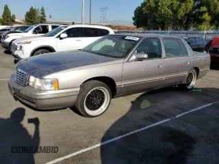 1997 Cadillac DeVille DHS z VIN 1G6KE54Y3VU299087, wystawiony jako Copart lot #69035944 z przebiegiem Nie podano mil oraz Czysty tytuł • Clean title. Historia ofert i sprzedaży dostępna na DreamBid. Obrazek 1.