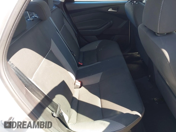 2013 Ford Focus SE z VIN 1FADP3F23DL306241, wystawiony jako IAAI lot #41980497 z przebiegiem 63 313 mil mil oraz . Historia ofert i sprzedaży dostępna na DreamBid. Obrazek 8.