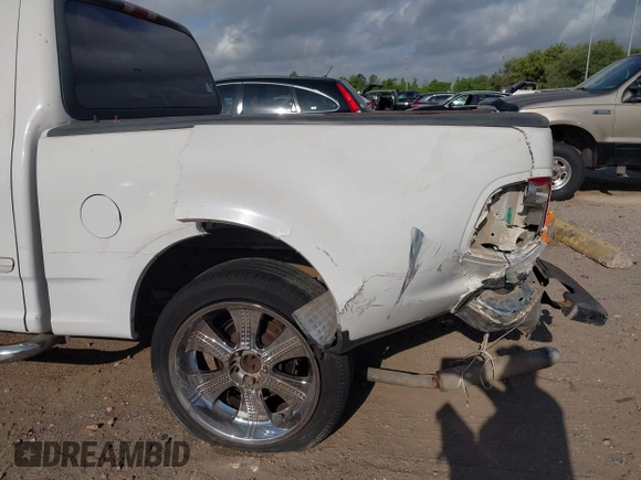2001 Ford F-150 XLT with VIN 1FTRW07L81KE91672, listed as a IAAI auction lot 42021661 with 200,000 mi miles and . Bid and sale history available at DreamBid. Image 17.