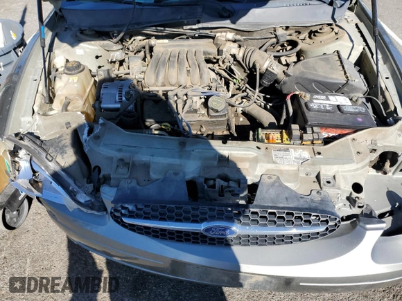 2001 Ford Taurus LX Standard z VIN 1FAFP52U51A138332, wystawiony jako Copart lot #88528355 z przebiegiem 166 511 mil mil oraz Szkoda całkowita • Salvage title. Historia ofert i sprzedaży dostępna na DreamBid. Obrazek 11.