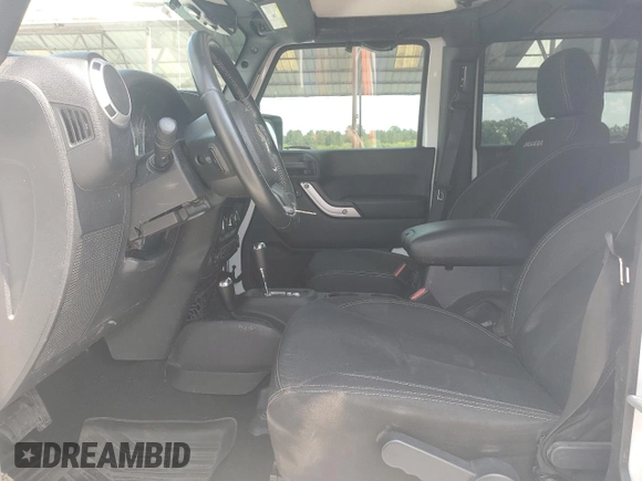 2016 Jeep Wrangler Unlimited Sahara with VIN 1C4BJWEG6GL182794, listed as a Copart auction lot 57880725 with 127,752 mi miles and Salvage title. Bid and sale history available at DreamBid. Image 7.