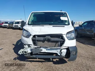 2023 Ford Transit Cargo with VIN 1FTYE1Y82PKA84762, listed as a IAAI auction lot 41718720 with 21,029 mi miles and . Bid and sale history available at DreamBid. Image 12.
