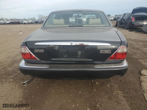 2000 Jaguar XJ with VIN SAJDA14C7YLF11390, listed as a Copart auction lot 73054184 with 0 mi miles and Salvage Title. Bid and sale history available at carsss.com. Image 6.