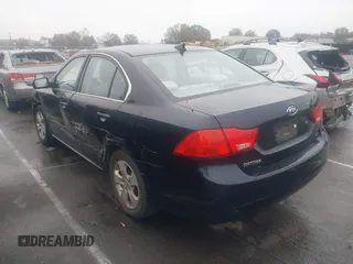 2009 Kia Optima LX z VIN KNAGE228095303047, wystawiony jako IAAI lot #41128475 z przebiegiem 165 317 mil mil oraz . Historia ofert i sprzedaży dostępna na DreamBid. Obrazek 3.