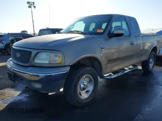 2001 Ford F-150 XL with VIN 1FTRX18L31NA75349, listed as a IAAI auction lot 40921255 with 165,872 mi miles. Bid and sale history available at carsss.com. Image 2.