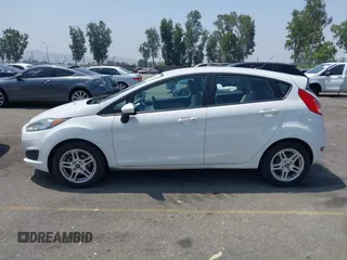 2018 Ford Fiesta SE z VIN 3FADP4EJ8JM141067, wystawiony jako IAAI lot #42417301 z przebiegiem 71 150 mil mil oraz . Historia ofert i sprzedaży dostępna na DreamBid. Obrazek 14.