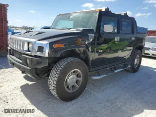 2005 Hummer H2 SUT with VIN 5GRGN22U65H113129, listed as a Copart auction lot 77315854 with 185,197 mi miles and Salvage Title. Bid and sale history available at carsss.com. Image 1.
