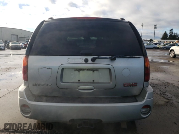 2006 GMC Envoy SLE with VIN 1GKDT13S262327772, listed as a Copart auction lot 85270134 with 242,390 mi miles and Salvage Title. Bid and sale history available at carsss.com. Image 6.