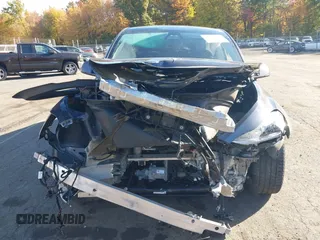 2020 Tesla Model Y Long Range with VIN 5YJYGDEE0LF041762, listed as a IAAI auction lot 40556913 with Not Provided miles and . Bid and sale history available at DreamBid. Image 13.