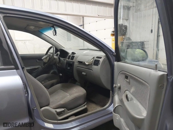2003 Kia Rio with VIN KNADC125536274171, listed as a IAAI auction lot 41986369 with 59,837 mi miles. Bid and sale history available at carsss.com. Image 5.