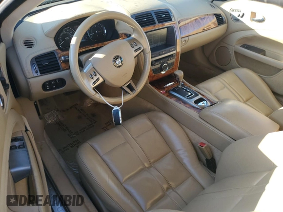 2007 Jaguar XK with VIN SAJDA44B075B06208, listed as a Copart auction lot 82694984 with 74,003 mi miles and Salvage Title. Bid and sale history available at carsss.com. Image 8.