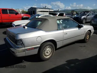 1992 Chrysler LeBaron z VIN 1C3X44539NF136763, wystawiony jako Copart lot #51253645 z przebiegiem 73 364 mil mil oraz Czysty tytuł • Clean title. Historia ofert i sprzedaży dostępna na DreamBid. Obrazek 3.