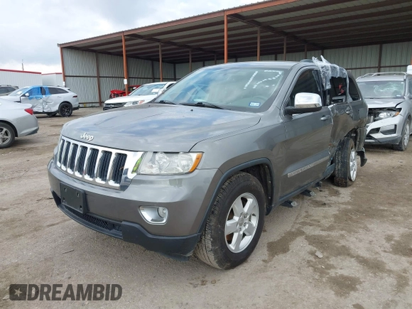 2013 Jeep Grand Cherokee Laredo with VIN 1C4RJEAG2DC571569, listed as a IAAI auction lot 41100518 with 98,265 mi miles. Bid and sale history available at carsss.com. Image 17.