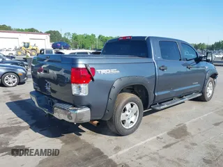 2010 Toyota Tundra with VIN 5TFEY5F11AX097360, listed as a IAAI auction lot 41990256 with 350,830 mi miles and . Bid and sale history available at DreamBid. Image 4.