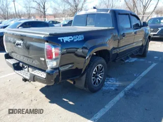 2021 Toyota Tacoma 4WD SR5 with VIN 3TMDZ5BN4MM117564, listed as a IAAI auction lot 41629220 with 77,063 mi miles. Bid and sale history available at carsss.com. Image 4.