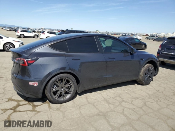 2025 Tesla Model Y Long Range with VIN 7SAYGDED4SF240354, listed as a Copart auction lot 52049745 with 6,785 mi miles and Salvage Title. Bid and sale history available at DreamBid. Image 3.