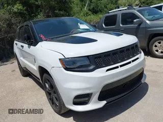 2015 Jeep Grand Cherokee Summit z VIN 1C4RJFJTXFC173287, wystawiony jako IAAI lot #42794100 z przebiegiem 125 705 mil mil oraz . Historia ofert i sprzedaży dostępna na DreamBid. Obrazek 1.