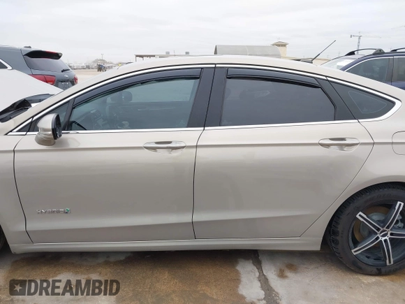 2016 Ford Fusion Titanium Hybrid with VIN 3FA6P0RU9GR143203, listed as a IAAI auction lot 41332144 with 94,357 mi miles. Bid and sale history available at carsss.com. Image 15.