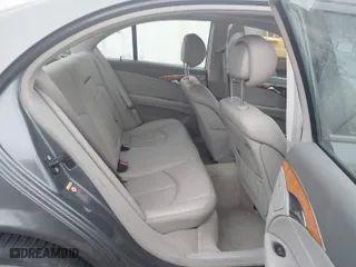 2006 Mercedes-Benz E-Class 3.5L with VIN WDBUF87J26X207923, listed as a IAAI auction lot 41479006 with 154,024 mi miles. Bid and sale history available at carsss.com. Image 8.
