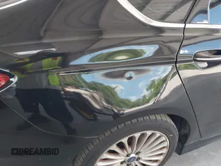 2016 Ford Fusion Titanium with VIN 3FA6P0K99GR235692, listed as a IAAI auction lot 42587743 with 169,467 mi miles and . Bid and sale history available at DreamBid. Image 6.