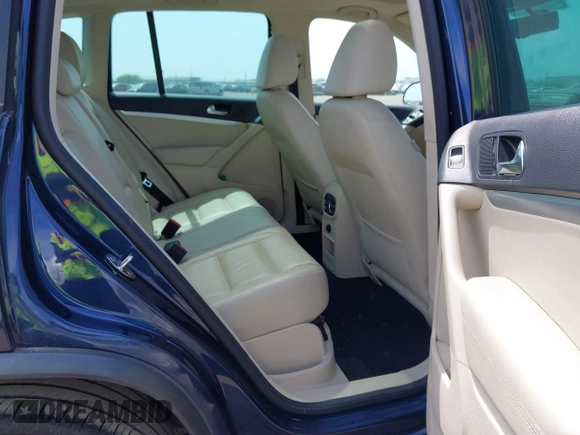 2012 Volkswagen Tiguan SEL with VIN WVGAV7AX8CW536752, listed as a IAAI auction lot 41798619 with 128,223 mi miles and . Bid and sale history available at DreamBid. Image 8.