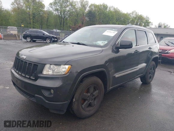 2011 Jeep Grand Cherokee Laredo with VIN 1J4RR4GGXBC604304, listed as a IAAI auction lot 42201742 with 196,483 mi miles and . Bid and sale history available at DreamBid. Image 2.