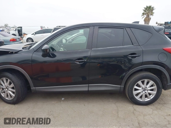 2014 Mazda CX-5 Touring z VIN JM3KE2CY3E0355332, wystawiony jako IAAI lot #42096306 z przebiegiem 108 198 mil mil oraz . Historia ofert i sprzedaży dostępna na DreamBid. Obrazek 13.