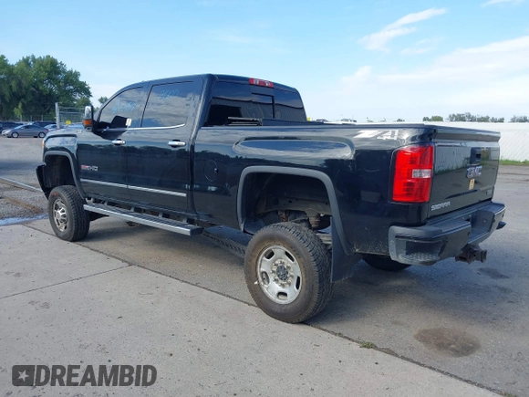 2015 GMC Sierra 2500HD SLT with VIN 1GT12ZE87FF552599, listed as a IAAI auction lot 40054977 with 146,190 mi miles and . Bid and sale history available at DreamBid. Image 3.