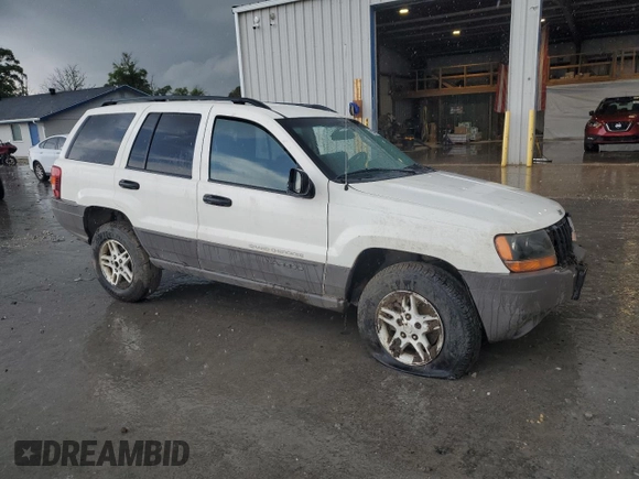 2004 Jeep Grand Cherokee Laredo z VIN 1J4GW48S74C165732, wystawiony jako Copart lot #56316885 z przebiegiem 177 139 mil mil oraz Szkoda całkowita • Salvage title. Historia ofert i sprzedaży dostępna na DreamBid. Obrazek 4.