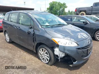 2012 Mazda 5 Sport z VIN JM1CW2BL9C0137053, wystawiony jako IAAI lot #42431488 z przebiegiem 63 748 mil mil oraz . Historia ofert i sprzedaży dostępna na DreamBid. Obrazek 1.