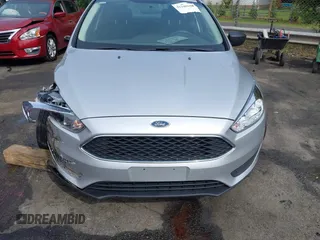 2017 Ford Focus S z VIN 1FADP3E21HL241557, wystawiony jako IAAI lot #42100036 z przebiegiem 106 764 mil mil oraz . Historia ofert i sprzedaży dostępna na DreamBid. Obrazek 17.