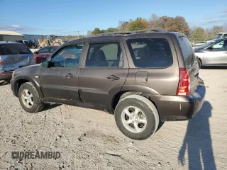 2006 Mazda Tribute S with VIN 4F2YZ04116KM23873, listed as a Copart auction lot 79926084 with 67,142 mi miles and Salvage Title. Bid and sale history available at DreamBid. Image 2.