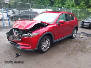 2019 Mazda CX-5 Grand Touring with VIN JM3KFBDM8K0693622, listed as a IAAI auction lot 42503818 with 60,812 mi miles and . Bid and sale history available at DreamBid. Image 17.